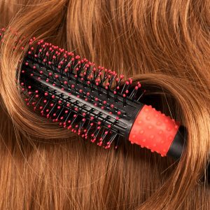 Long red human hair with a comb