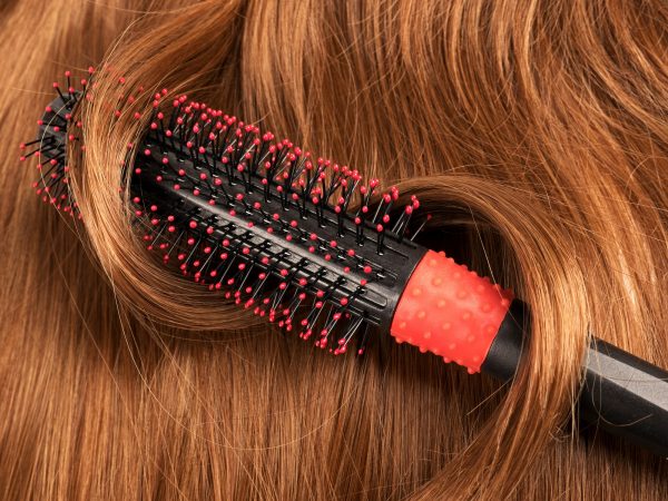 Long red human hair with a comb